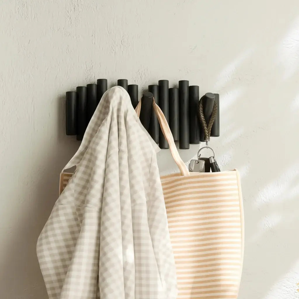 Wall-Mounted Rack with Retractable Pegs